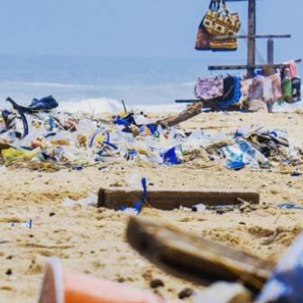 beach covered in garbage and plastic